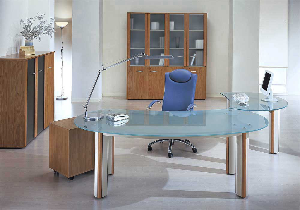 Office space with oval glass desk, blue leather chair, wooden cabinets, and desk lamp
